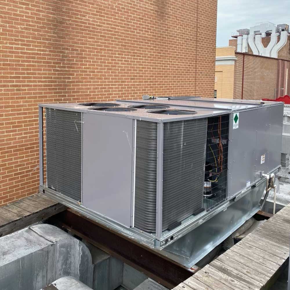 commercial-air-conditioning-unit-outside-of-red-brick-building-ellington-mechanical-services